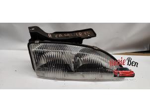 Gebruikte Koplamp rechts Chevrolet Cavalier 2.2 RS Prijs € 25,00 Margeregeling aangeboden door Rooie Ben autodemontage
