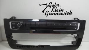 Gebruikte Radiobedienings paneel BMW 1-Serie Prijs € 45,00 Margeregeling aangeboden door Gebr.Klein Gunnewiek Ho.BV