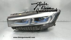 Gebruikte Koplamp links BMW 7-Serie Prijs € 1.695,00 Margeregeling aangeboden door Gebr.Klein Gunnewiek Ho.BV