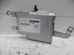 Gebruikte Radio module Mazda 3 (BM/BN) 2.2 SkyActiv-D 150 16V Prijs € 150,00 Margeregeling aangeboden door Verhoef Cars & Parts