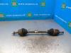 Opel Corsa E 1.2 16V Aandrijfas links-voor