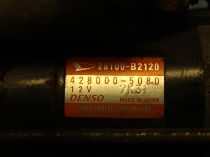 Startmotor van een Daihatsu Cuore (L251/271/276) 1.0 12V DVVT 2009
