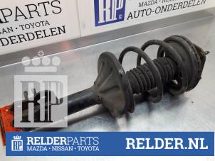 Gebruikte Schokdemperpoot links-voor Mazda 626 (GE14/74/84) 1.8i 16V Prijs € 41,00 Margeregeling aangeboden door Relder Parts B.V.