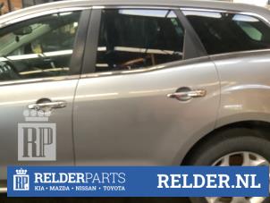 Gebruikte Portiergreep 4Deurs links-achter Mazda CX-7 2.2 MZR-CD 16V Prijs € 25,00 Margeregeling aangeboden door Relder Parts B.V.