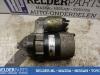 Startmotor van een Nissan Primera (P12) 1.8 16V 2003