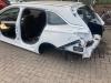 Hoek Carrosserie links-achter van een Opel Astra K Sports Tourer 1.5 CDTi 122 12V 2021