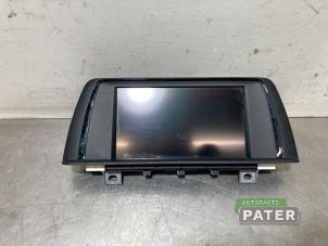 Gebruikte Display Multi Media regelunit BMW 1 serie (F20) 118d 2.0 16V Prijs € 157,50 Margeregeling aangeboden door Autoparts Pater