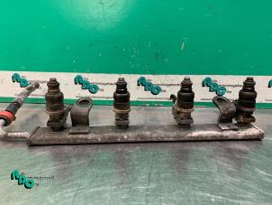 Injector brug van een Mitsubishi Colt (Z2/Z3) 1.3 16V 2004