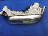 Koplamp links van een Mazda 626 (GE14/74/84) 1.8i LX,GLX 16V 1997