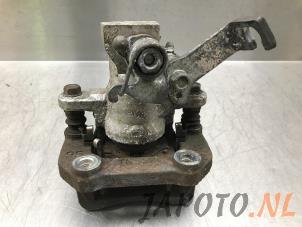 Gebruikte Remklauw (Tang) links-achter Suzuki Swift (ZA/ZC/ZD) 1.2 16V Prijs € 68,20 Margeregeling aangeboden door Japoto Parts B.V.