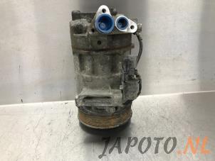Gebruikte Pomp Airco Nissan Qashqai (J11) 1.2 DIG-T 16V Prijs € 131,20 Margeregeling aangeboden door Japoto Parts B.V.