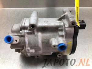 Gebruikte Aircopomp Mazda 2 Hybrid 1.5 12V Prijs € 367,45 Margeregeling aangeboden door Japoto Parts B.V.