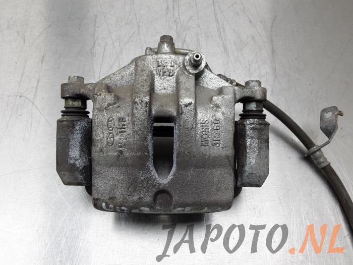 Front brake calliper, left - de0c078a-e64b-49bd-9973-21163f4c2f85.jpg