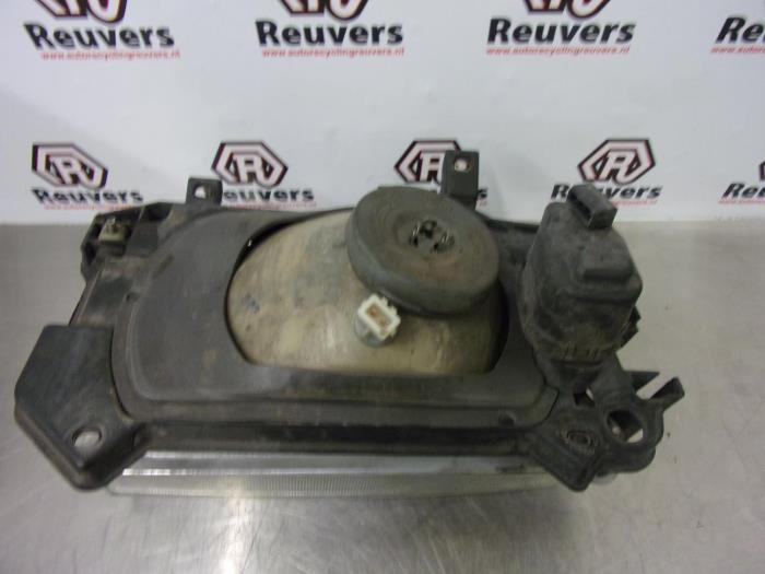 Koplamp rechts van een Volkswagen Transporter/Caravelle T4 1.9 TD 1995