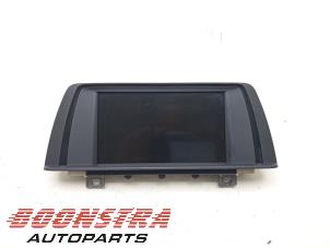Gebruikte Display Interieur BMW 1 serie (F20) 114d 1.6 16V Prijs € 202,95 Margeregeling aangeboden door Boonstra Autoparts