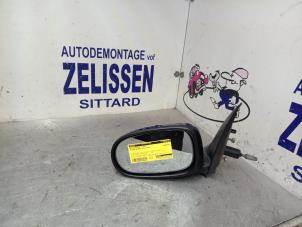 Gebruikte Spiegel Buiten links Nissan Almera (N16) 1.5 16V Prijs € 36,75 Margeregeling aangeboden door Zelissen V.O.F. autodemontage