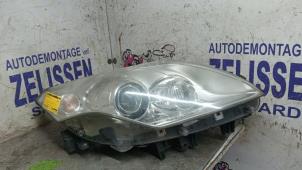 Gebruikte Rechter Koplamp Renault Laguna III (BT) 2.0 16V Prijs € 194,25 Margeregeling aangeboden door Zelissen V.O.F. autodemontage
