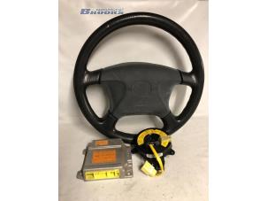 Gebruikte Airbag links (Stuur) Mazda 323 Fastbreak (BJ14) 1.5 LX,GLX 16V Prijs € 25,00 Margeregeling aangeboden door Autobedrijf Brooks