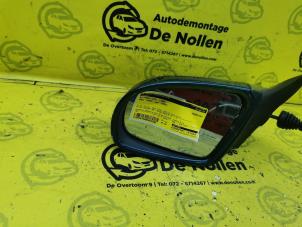 Gebruikte Spiegel Buiten links Opel Corsa B (73/78/79) 1.2i 16V Prijs € 25,00 Margeregeling aangeboden door de Nollen autorecycling
