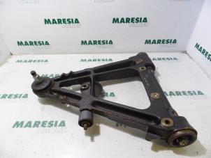 Gebruikte Draagarm onder links-voor Alfa Romeo 75 (162B) Prijs € 25,00 Margeregeling aangeboden door Maresia Parts