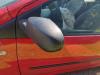 Buitenspiegel links van een Renault Twingo II (CN) 1.5 dCi 90 FAP 2011