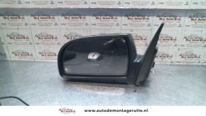 O85018 Gebruikte spiegel buiten links Kia Carens