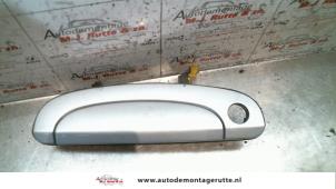 O79804 Gebruikte portiergreep 2deurs links Hyundai Getz