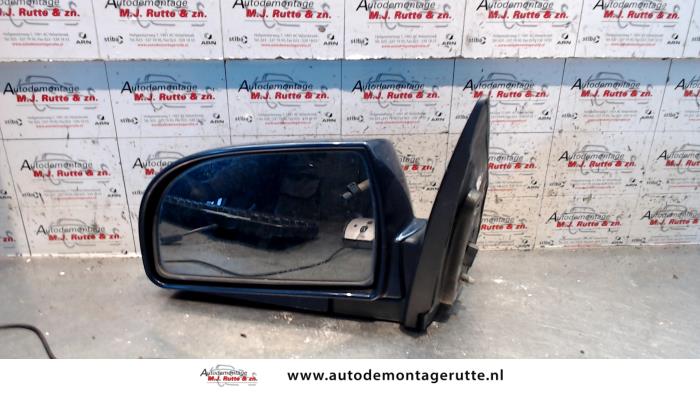 Gebruikte Spiegel Buiten links Kia Carens O85019
