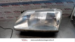 O72744 Gebruikte linker koplamp Renault Megane Scenic