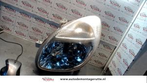 O73017 Gebruikte linker koplamp Daihatsu Sirion