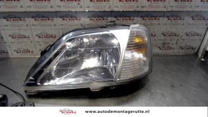 O72347 Gebruikte koplamp links Dacia Logan