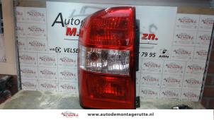 O93455 Gebruikte achterlicht links Kia Carnival