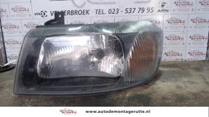 O71803 Gebruikte koplamp links Ford Transit