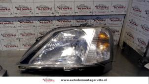 O72346 Gebruikte koplamp links Dacia Logan