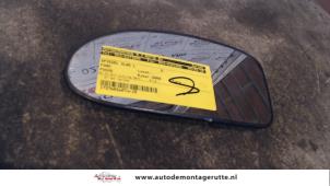 Gebruikte Spiegelglas links Ford Focus 1 1.4 16V Prijs op aanvraag aangeboden door Autodemontage M.J. Rutte B.V.
