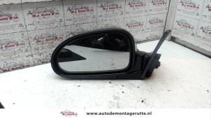 O84886 Gebruikte buitenspiegel links Hyundai Coupe
