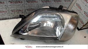 O72344 Gebruikte koplamp links Dacia Logan