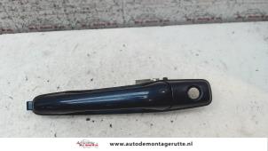 O80384 Gebruikte portiergreep 4deurs links-voor Mitsubishi Lancer