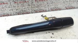 O89475 Gebruikte portiergreep 4deurs links-achter Mitsubishi Lancer