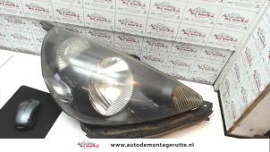O74379 Gebruikte rechter koplamp Honda Jazz