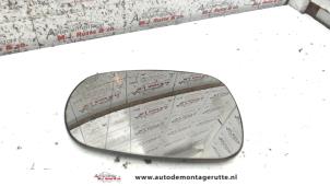 O86090 Gebruikte spiegelglas links Nissan Micra