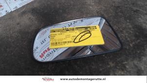 O86057 Gebruikte spiegelglas links Mazda 323F