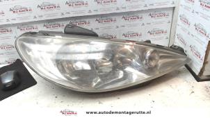 O74142 Gebruikte koplamp rechts Peugeot 206