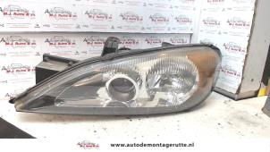 O72404 Gebruikte linker koplamp Nissan Primera