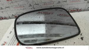 O86323 Gebruikte spiegelglas links Suzuki Liana