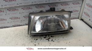 O73036 Gebruikte koplamp links Seat Ibiza