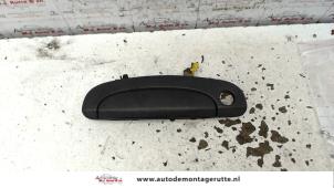 O79803 Gebruikte portiergreep 2deurs links Hyundai Getz