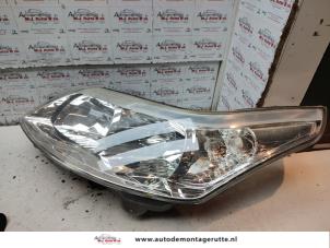 O134575 Gebruikte koplamp links Citroen C4