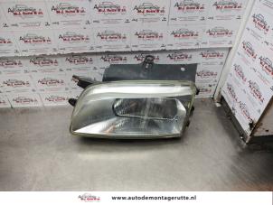O138242 Gebruikte linker koplamp Citroen Berlingo