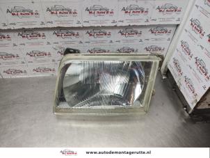 O140013 Gebruikte koplamp links Ford Transit